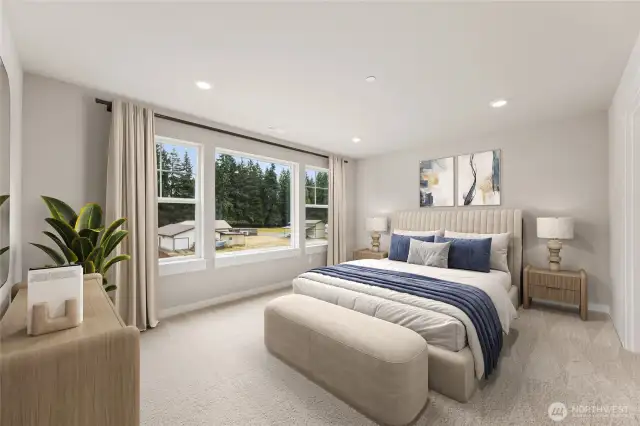 Large primary bedroom can hold a King size mattress and more. Features very large windows for natural light. Photo contains virtual staging.