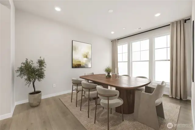 Formal dining room with huge windows for natural light. Virtual staging in photo.