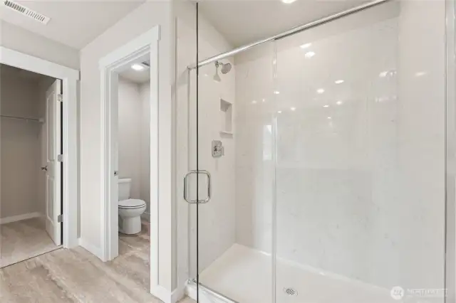 5-piece primary bathroom includes step-in shower, double vanity, and freestanding bathtub.