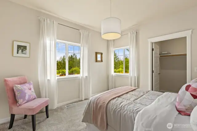 Bedroom #2 with a walk-in closets and windows on two walls