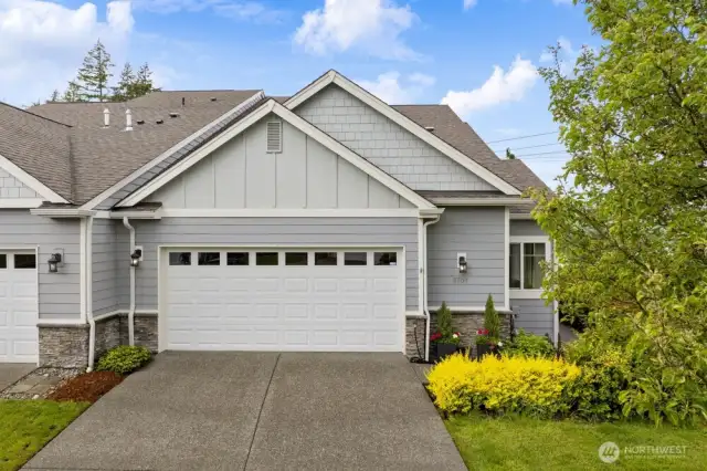 The interior of the attached, 2-car garage has been finished and painted, and the driveway offers parking for 2 cars.