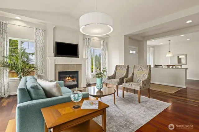 Open flow living room accompanied with a cozy gas fireplace. Hardwood floors throughout the living areas on the main floor.