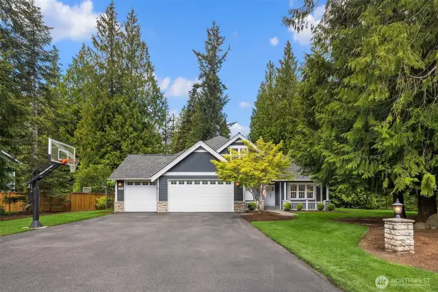 Absolutely stunning Woodinville home with 4 bedrooms up and 1 bedroom/office on the main level.  With a flat, shy acre lot, a a storage shed and a shop/shed with electricity and heat, a 3-car garage, AND a hot tub, this home has everything you want and more!