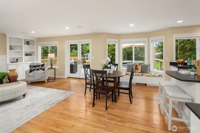 Gleaming hardwood floors throughout the entire main floor.  Wall of windows, stretching from family room to kitchen showcasing breathtaking views of the gorgeous backyard.