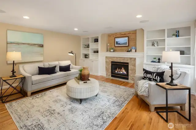 Built-in shelving and cabinetry create a cohesive feel with the kitchen across the way.