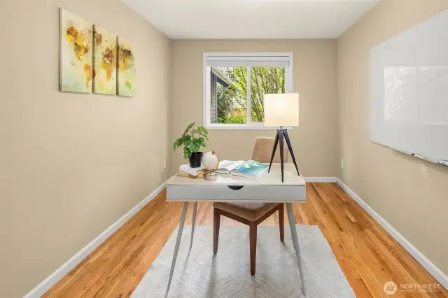 Main floor office, or 5th bedroom, features a closet and a glass writing board.  Tucked away from the main hub of the downstairs, this room offers a quiet respite where you can focus on work.  Closet wired with Cat5 to every room