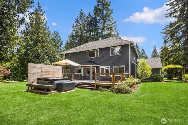 Looking back at the house, perfectly sited on the lot, with space on both sides, and an ample front yard but with a vast back yard, giving loads of privacy.