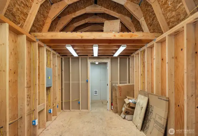 Inside the shop!  A wonderful space for creating!  Seller used this space as a forge for iron working, but would make a great wood working shop, or pottery room.  Electricy and heat, storage up above and the back portion has a wall heater - maybe a private office?  So many opportunities, use your imagination!