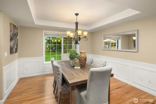 Acros from the living room is the dining room, with windows looking out over the backyard.
