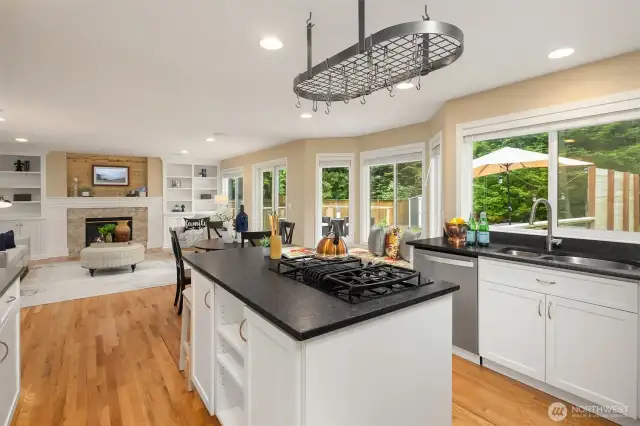 Crisp white cabinetry and black granite countertops create a classic look.  Gas range, stainless appliances.