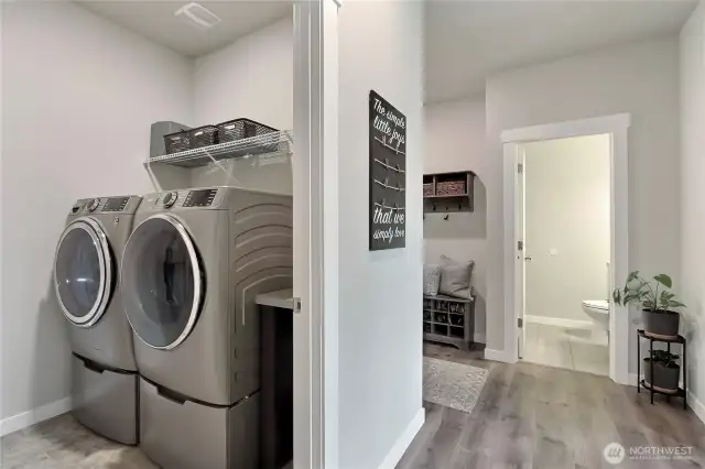 Laundry room. Main level 3/4 bath in the distance.