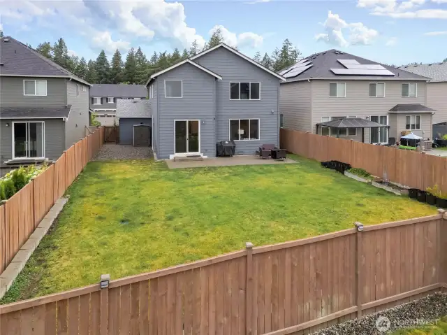 Large fenced back yard has room for putting in a garden. Storage shed on left side of house. Graveled area could easily convert to a dog run.
