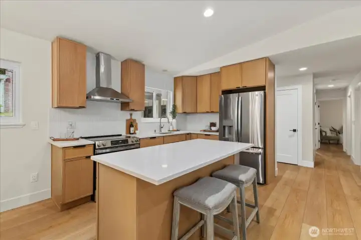 Open concept living, kitchen, dining area.