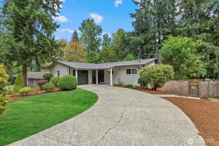 Front of the home.  Private garage parking and plenty of driveway parking as well.