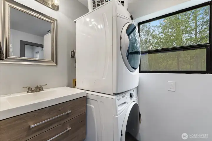 Nicely remodeled main full bath, which is also home to the laundry room