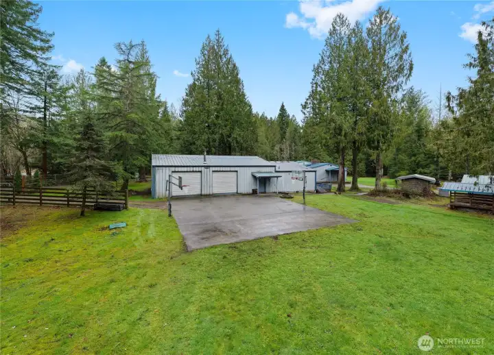 In the back of the ADU & shop/garage is the sports court & the full RV hook-up