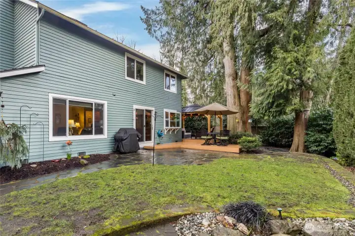 Fully-fenced yard with mature landscaping