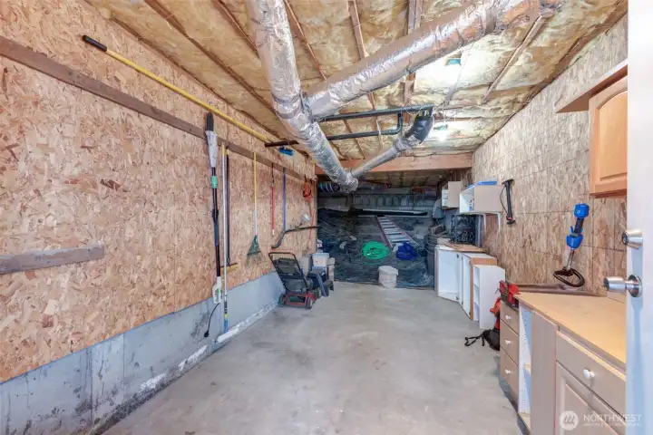 Sellers set this up as their shop, project, tool storage area! You can see the wide open crawl space behind the shop.