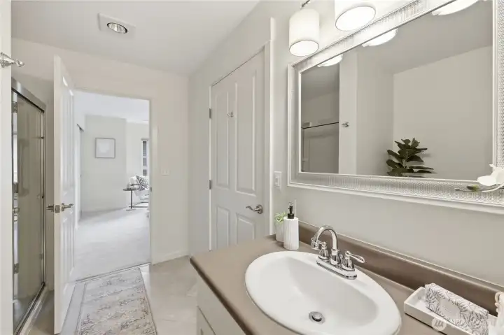 Bathroom accessible from primary bedroom and hall.