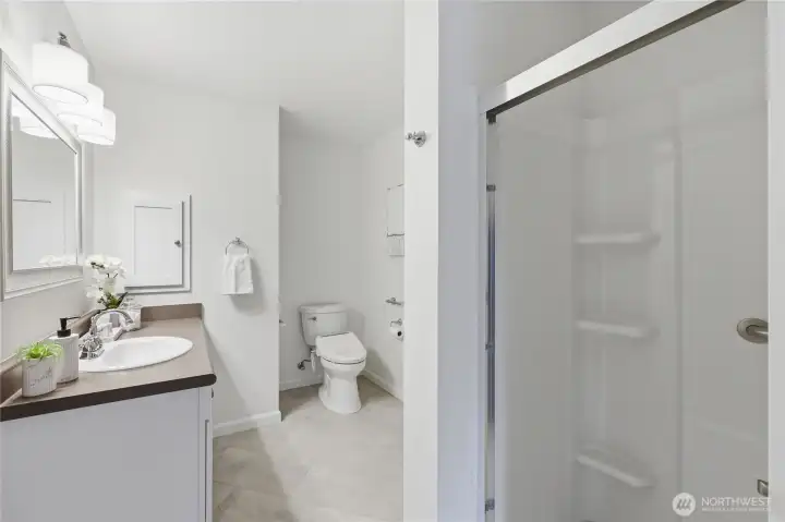 Easy-entry shower stall with built-in shelves.