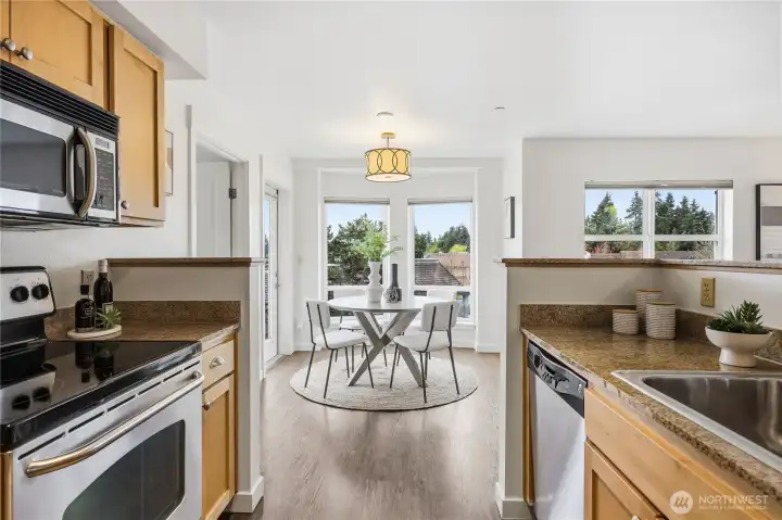 The dining area is welcoming and provides access to a balcony, making it an excellent space for dining and outdoor enjoyment.