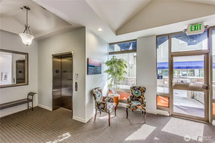 The main level entryway to the Island Crossings complex. Mailboxes, elevator, as well as garage access can be found here.