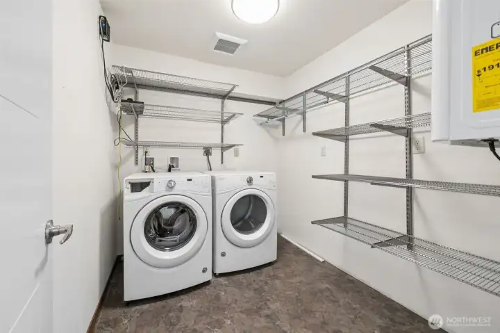 Huge laundry room with tons of Elfa storage