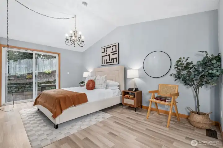 Large Primary Bedroom on the Main Floor with sliding door to wrap-around deck.