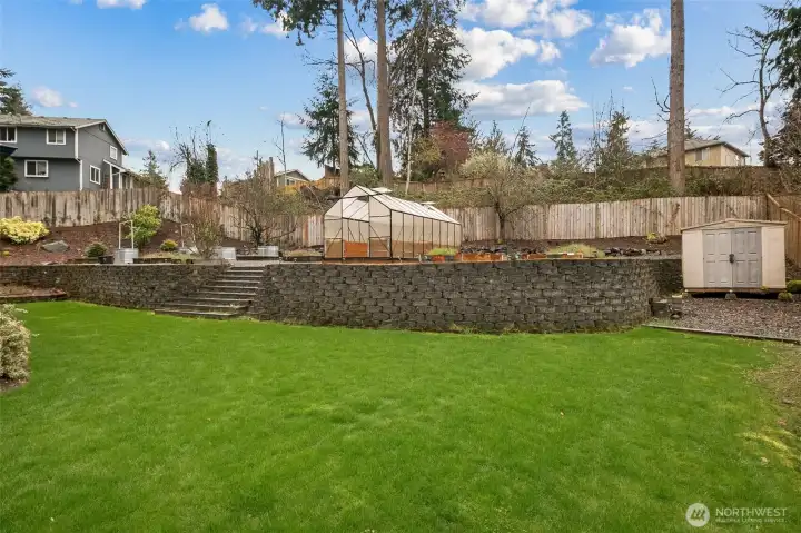 Fully fenced yard with Berries, fruit trees (Apples and Pears), greenhouse.