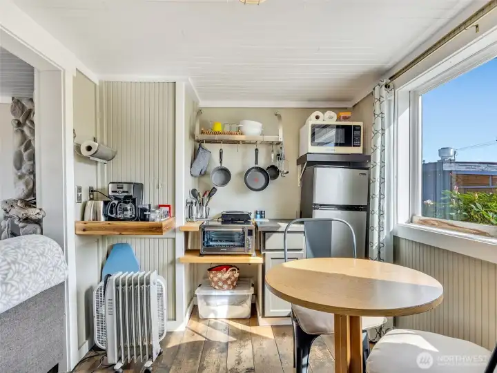 Kitchen and dining area with easy indoor-outdoor flow for coastal living