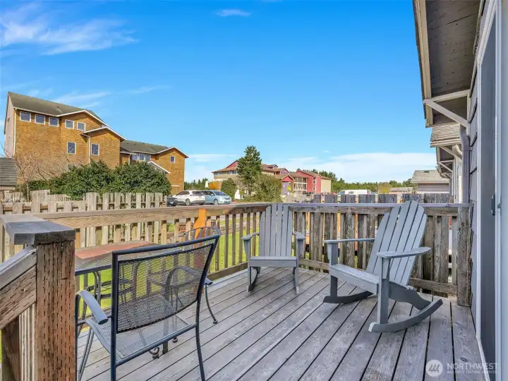 Outdoor patio area with seating ideal for entertaining or relaxing near the beach