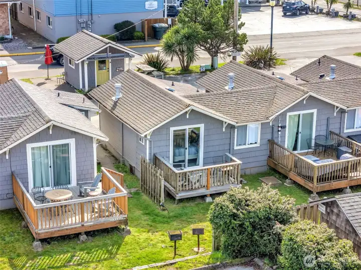 Aerial of Akari Bungalows showing proximity to surrounding homes and coastal location