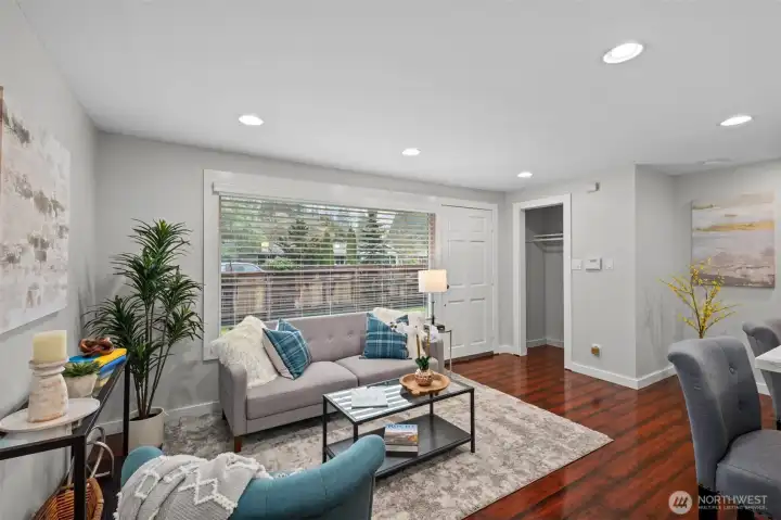Bright, welcoming living room could also function as a dining room!  Great natural light abounds from the front picture window.