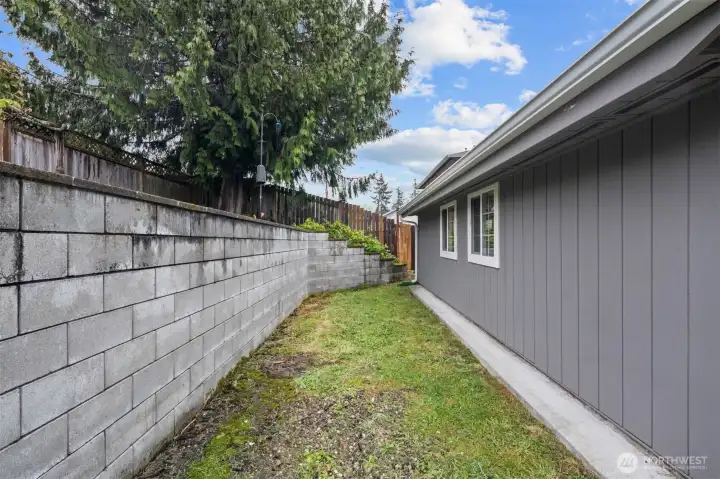 The space would function well as a small dogrun or you could extend the patio!