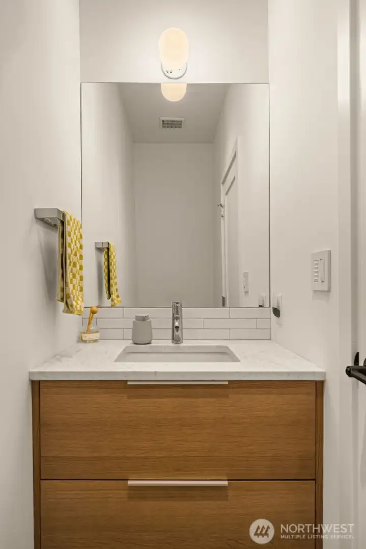 Powder room on main level off of the hallway.