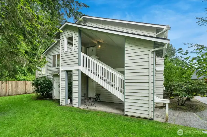 Looking out into exquisitely manicured lawn bordering unit on the side and back