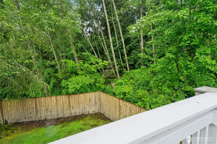 View off deck all across the back of home adjacent to lush greenbelt