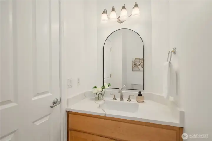 Main floor 1/2 bath with new countertops.