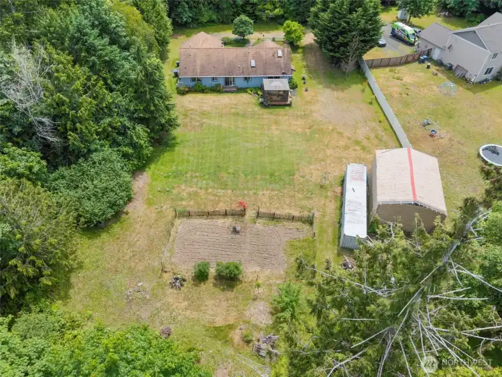 Back yard with container and covered RV parking Back yard with container and covered RV parking