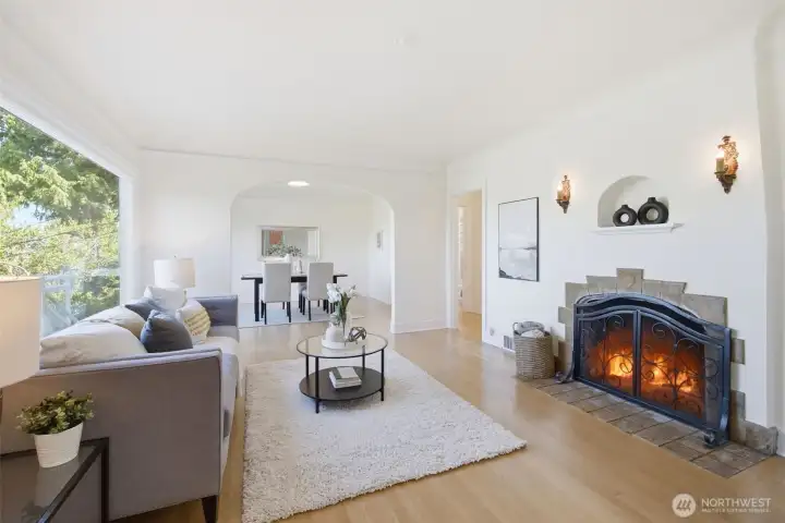 The West facing living room flows into the dining room, making for a seamless experience. The large windows capture tremendous natural light!