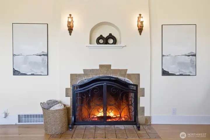 The classic wood burning fireplace and original candle sconces add warmth to the heart and soul.