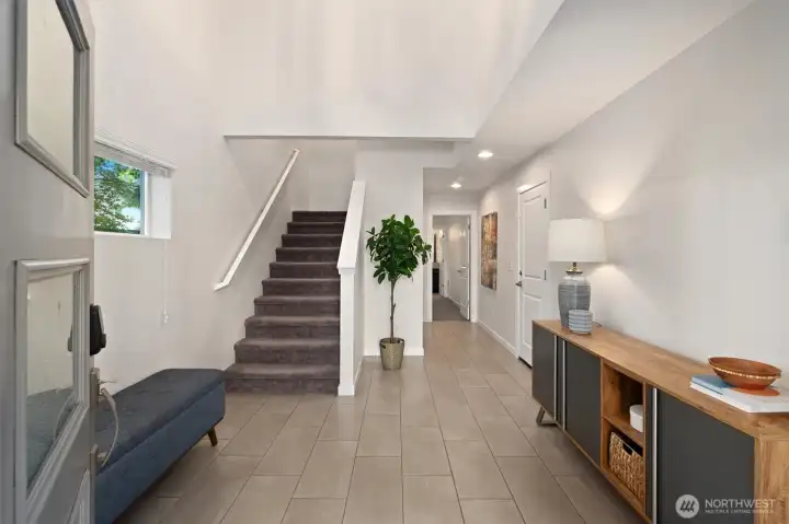 As you enter, you're greeted by a spacious foyer with soaring ceilings. Garage entry and 4th bedroom w/ ensuite bath are located on the ground level. As you enter, you're greeted by a spacious foyer with soaring ceilings. Garage entry and 4th bedroom w/ ensuite bath are located on the ground level.