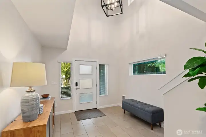 As you enter, you're greeted by a spacious foyer with soaring ceilings. As you enter, you're greeted by a spacious foyer with soaring ceilings.