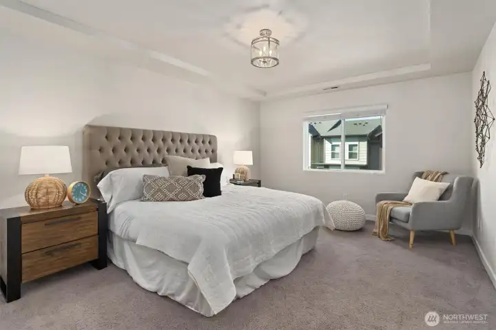 The spacious primary bedroom is located on the upper level, just down the hall from the two secondary bedrooms. The spacious primary bedroom is located on the upper level, just down the hall from the two secondary bedrooms.
