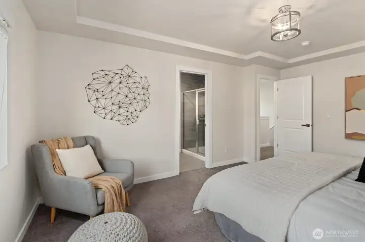 The spacious primary bedroom is located on the upper level, just down the hall from the two secondary bedrooms. The spacious primary bedroom is located on the upper level, just down the hall from the two secondary bedrooms.