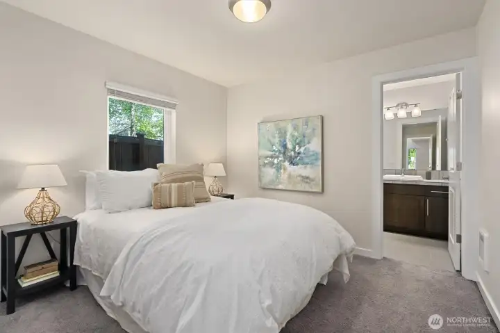 Ground-floor bedroom with an ensuite bath, ideal for guests, multigenerational living, or a private home office. Ground-floor bedroom with an ensuite bath, ideal for guests, multigenerational living, or a private home office.