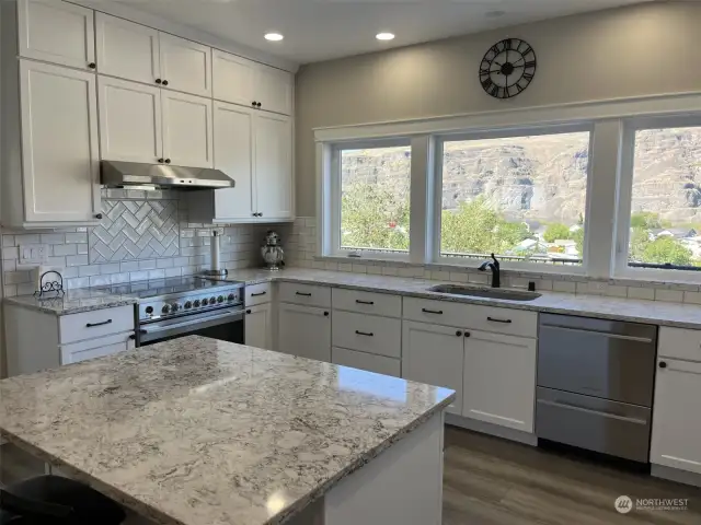 Gourmet Kitchen with beautiful granite an island. Amazing views from the 3 large windows.