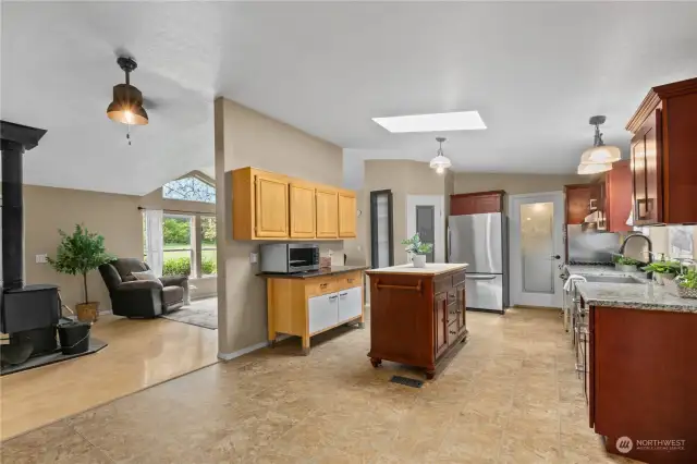 Large kitchen features stainless steel appliances,