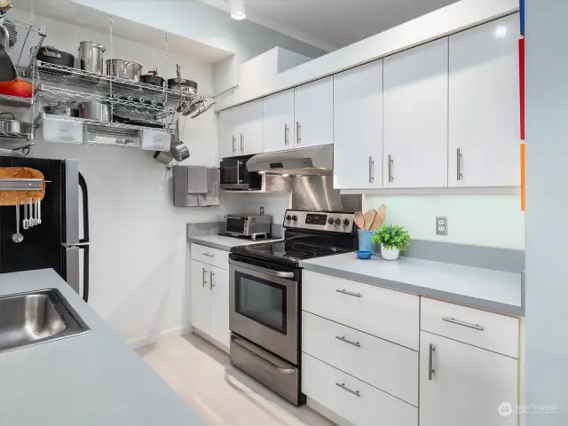 The owner loved to cook so has added tons of storage in the kitchen as well as a pantry area in the wall of closets from the entry