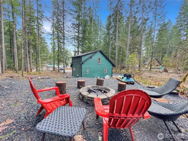 Custom fire pit overlooking the back of the house.